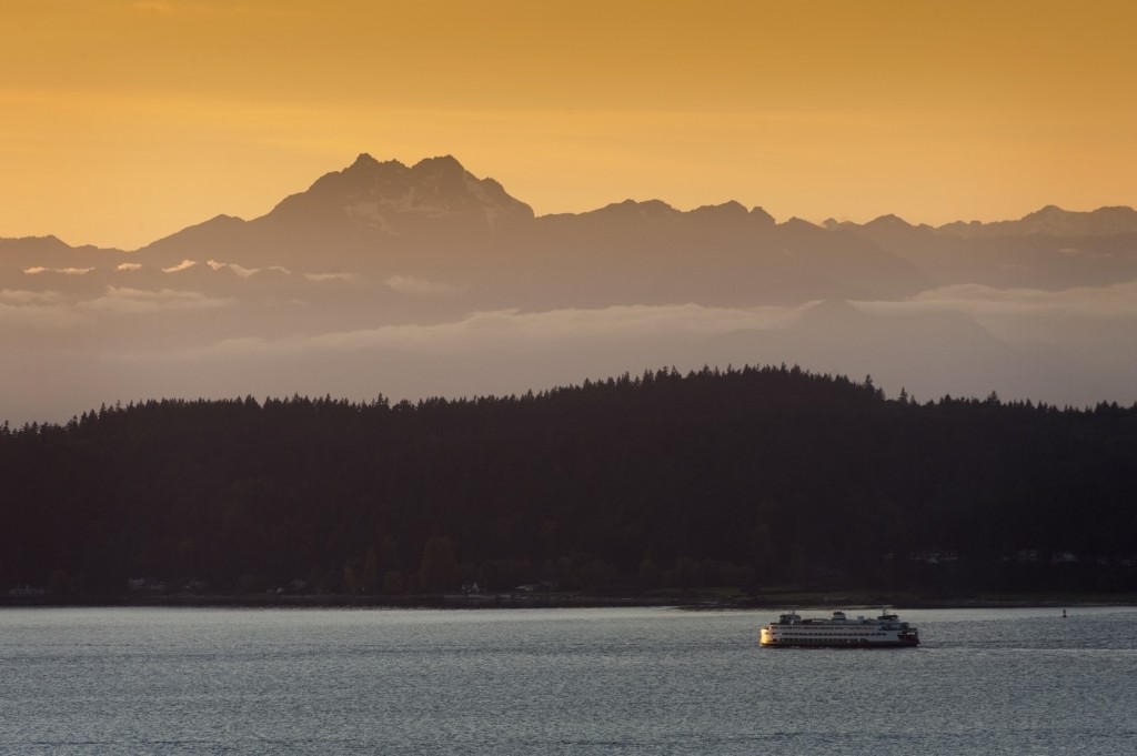 A ferry going over Puget Sound at sunset